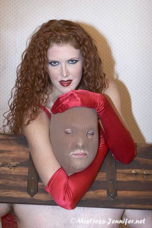 in bondage...Mistress Sabrina red haired amazon dominatrix ballbusts and loves femdom work