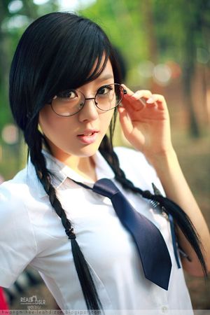 Cute asian schoolgirl doing her teacher