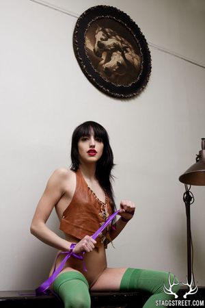 ARIEL WEARS GREEN THIGH HIGHS & TIES HER SELF UP WITH PURPLE RIBBONS