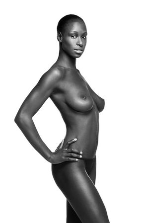 Beautiful, dark-skinned, perky black breasts.