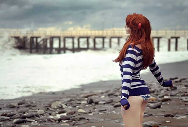 Beautiful red head on rocky beach