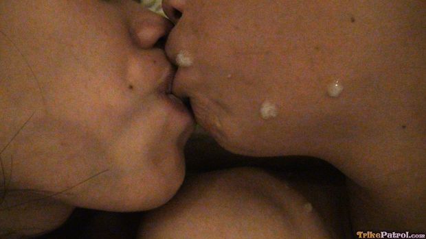 Two Filipina schoolgirls kissing passionately with cum facial on their faces