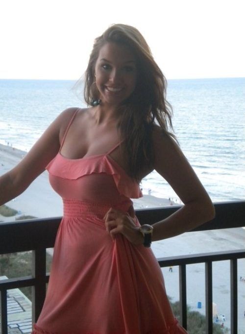 Hot girlfriend with big tits on the balcony.