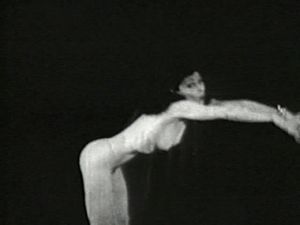 Skinny brunette girl dancing nude in a early 1900's vintage porn