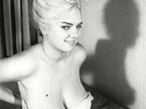 Cute frisky blonde getting naked in a vintage adult film