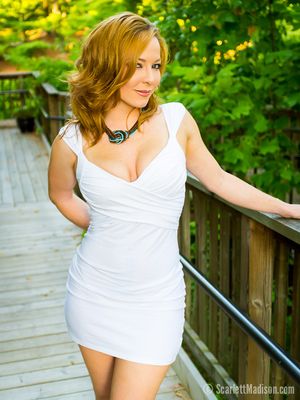 Hottie red head in white dress.