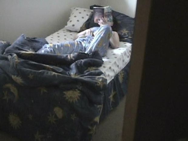 Watching a hot babe getting horny and masturbating in a hidden cam