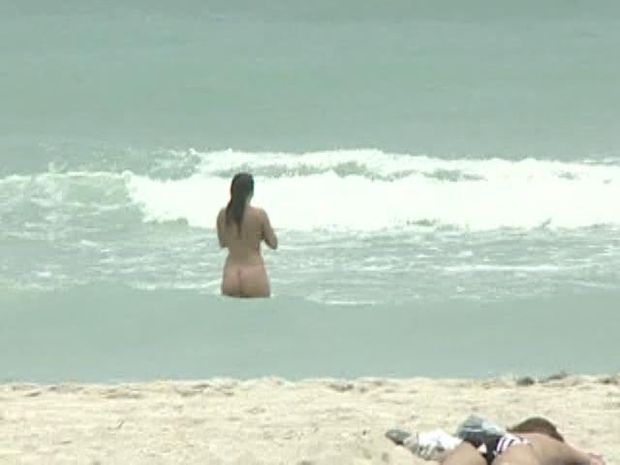 Hot brunette takes a swim in the nude and gets caught on cam