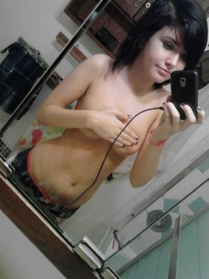 Sexy teen GF taking a topless self shot