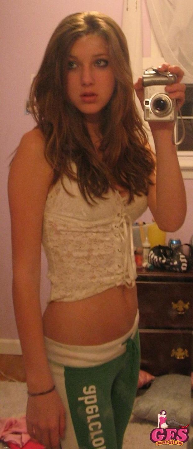 Sexy brunette GF takes a selfshot in her white corset