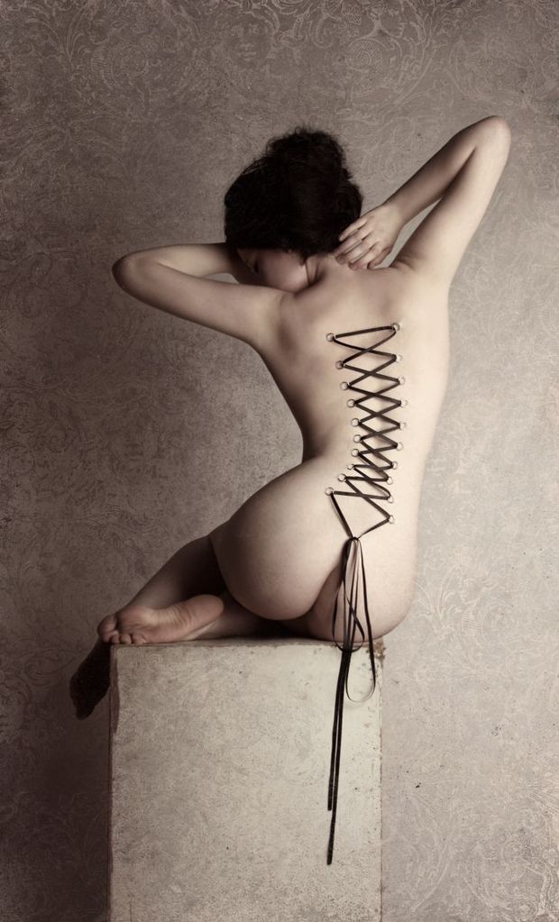 Sexy brunette in incredible bondage photo