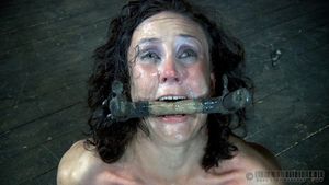 Love her grimace. Looks like a BDSM-induced monkey. Wonderfully...