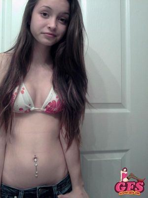 Brunette teen posing in her cute bikini top