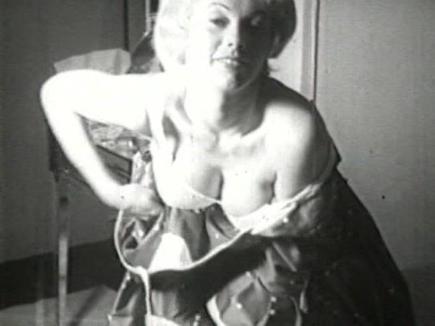 Vintage adult film of a mature blonde with big tits