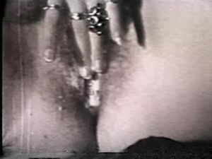 Blurry vintage porn, girl masturbates in close up for the camera showing her wet hairy pussy