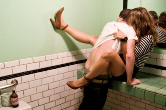 In a restroom. (much easier in a lockable, 1-person restroom... otherwise, you have to cram yourselves in a stall)