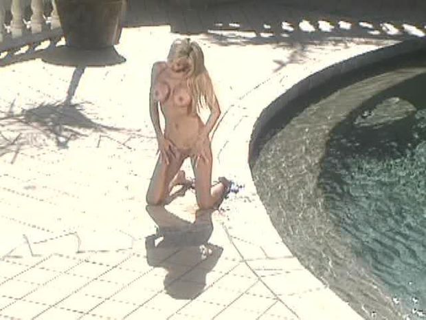 Blonde gets caught on camera sunbathing in the nude