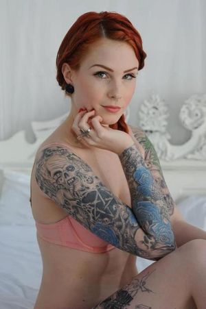 Smoking redhead hith tattoos