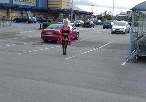 big tits British milf flashing her stockings in public