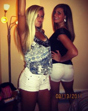 two sexy girls dancing and showing off their sexy legs and asses