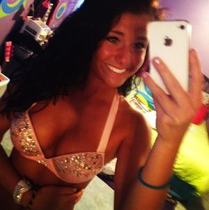 beautiful gorgeous sexy girl showing off her big tits in her shiny bra