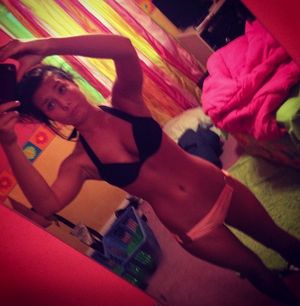 sexy girl showing off her big tits and her sexy hips