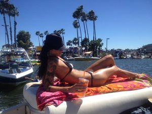 sexy girl sunbathing showing off her hot legs and body