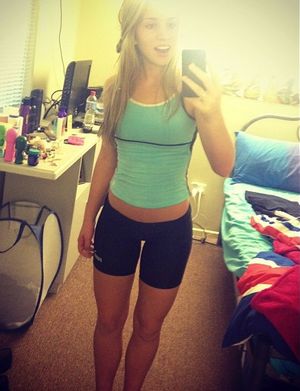 sexy blonde taking a selfshot showing off her sexy gap and legs in tight spandex