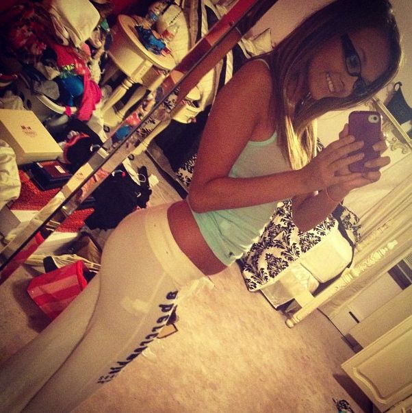 sexy nerdy girl in tight white yoga pants showing off her amazing ass!