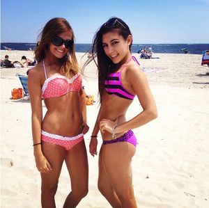 two cute girls with nice bodies at the beach. nice ass in the purple ;)