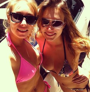 sexy sisters with big tits in swimsuits
