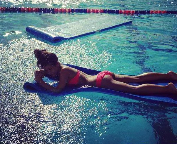cute girl in the pool showing off her ass