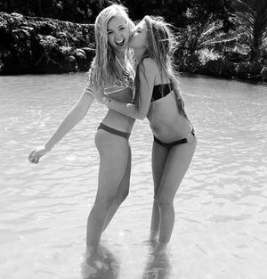 two beautiful girls with long sexy legs kissing