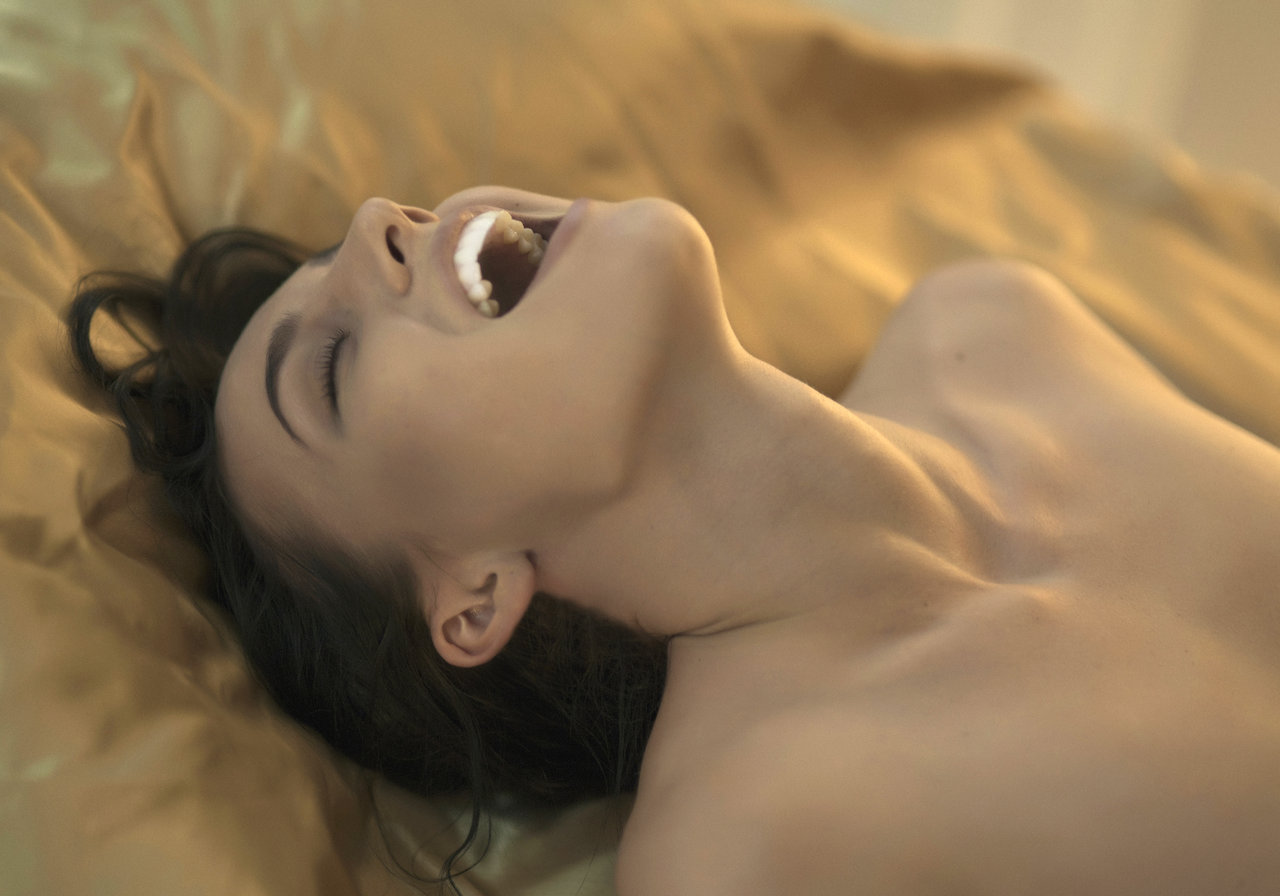 Irina has a smiling orgasm.
