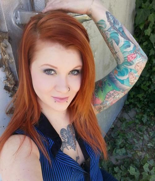 Tattooed redhead looking good