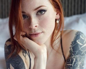 Sexy tattooed redhead