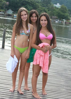 Lovely teen in a amazing girl next door threesome photo