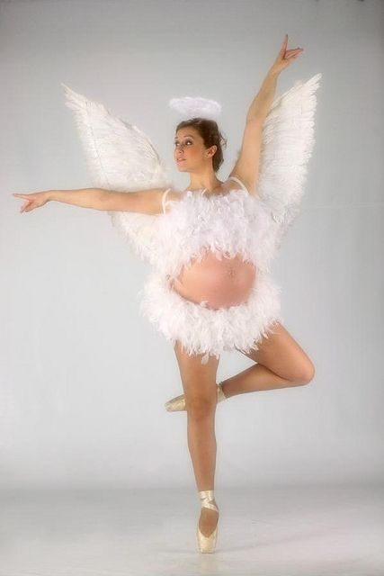 The beauty of a pregnant toedancing woman still able to dance on her tiptoes although very pregnant.