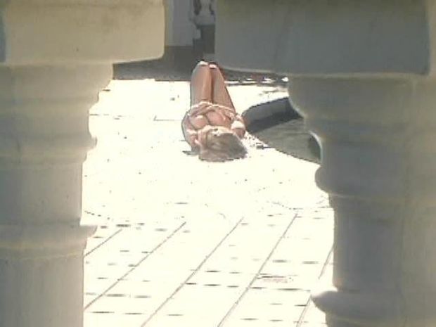 Spying on a hot babe sunbathing in the nude