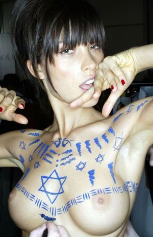 Petra gets some body-painting done.