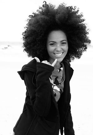 This natural, big-haired black chick is a total cutie-pie!