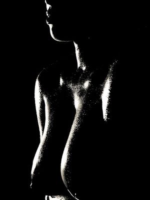 Beautiful, arty image of some shapely, big black breasts....