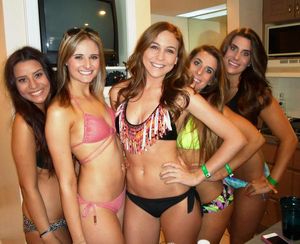 slutty girls wear their swimsuits to a party