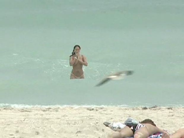 Topless babe at the beach