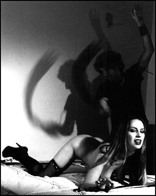 Slave bound to bed and getting a hot whipping