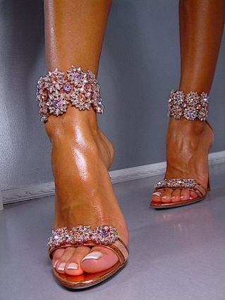 You can tell it's killing her to walk in these.  But they're so gorgeous she can't take them off!