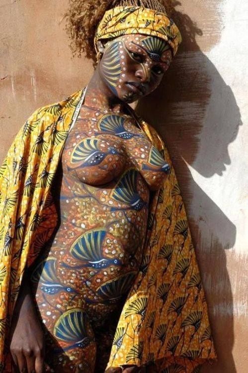 African beauty has her nude body decorated