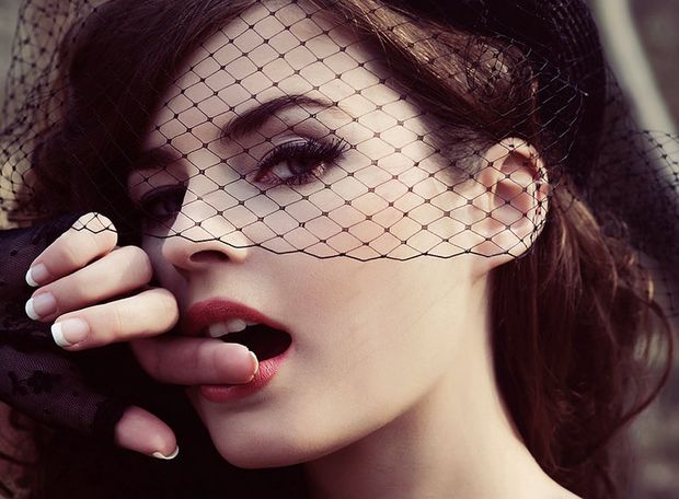 Shy Brunette bites finger.