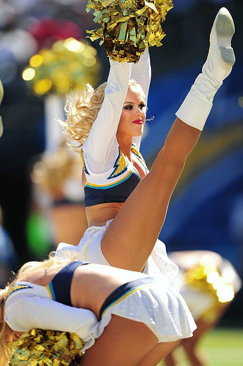 Charger Girls really put a charge in you with their sexy uniforms!  Is the bent over girl throwing up because she is pregnant?