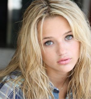 Blonde girl with green eyes looking cute